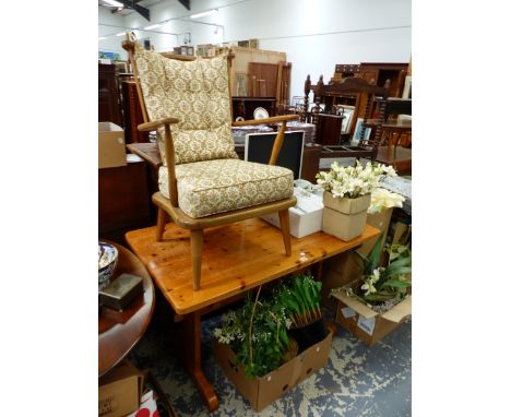 A BEECH ARMCHAIR WITH BUTTONED BACK CUSHION TOGETHER WITH A PINE TABLE.   W 122 x D 68 x H 74cms.