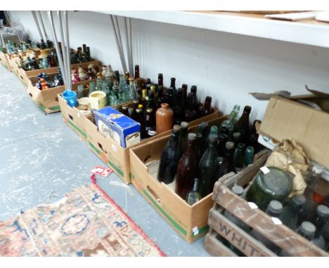 A VERY LARGE COLLECTION OF VINTAGE GLASS AND POTTERY BEER BOTTLES, JUGS, CRATES, AND OTHER BOTTLES ETC. 