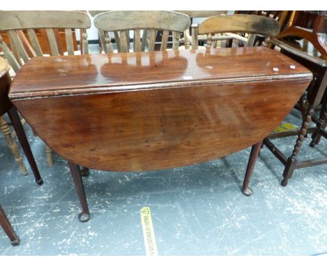 A MAHOGANY OVAL DROP FLAP DINING TABLE ON TAPERING CYLINDRICAL LEGS WITH PAD FEET