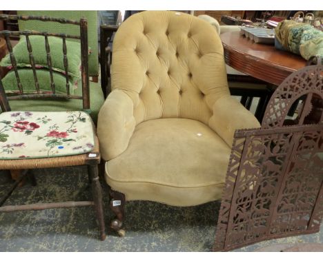AN OATMEAL VELVET UPHOLSTERED MAHOGANY BUTTON BACKED ARMCHAIR ON WHITE CERAMIC CASTOR FEET