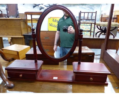 AN OVAL DRESSING TABLE MIRROR ON STAINED PINE TWO DRAWER BASE TOGETHER WITH A MAHOGANY DRESSING TABLE MIRROR BASE WITH SINGLE