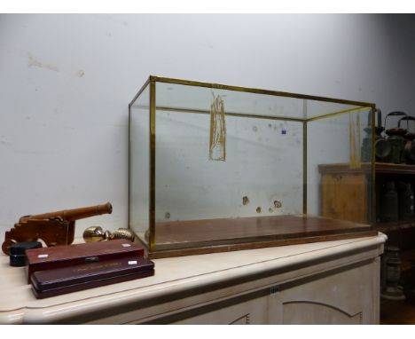 A GLAZED BRASS TABLE TOP DISPLAY CASE, A WOODEN CANNON, TWO CASES OF WINE SERVING IMPLEMENTS AND BRASS DOOR HANDLES