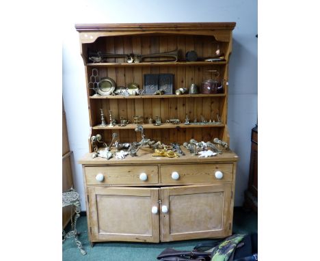 A PINE DRESSER WITH ENCLOSED THREE SHELF BACK.   W 141 x D 52 x H 208cms.