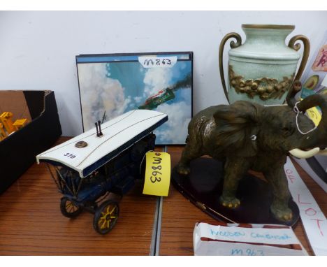 A MODEL TRACTION ENGINE AND THREE AIRCRAFT PRINTS, AN ELEPHANT FIGURE, LAMP BASE AND A WOODEN CALENDAR.