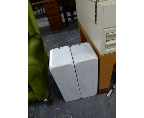 A MODERNIST BRUSHED METAL STANDARD LAMP SUPPORTED ON TWO WHITE MARBLE BLOCKS