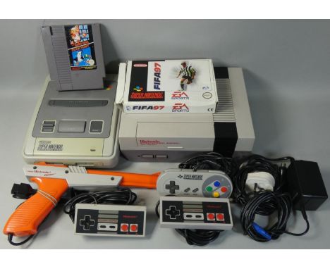 A Nintendo NES games console, together with a Nintendo SNES games console, power supply, television lead, various controllers