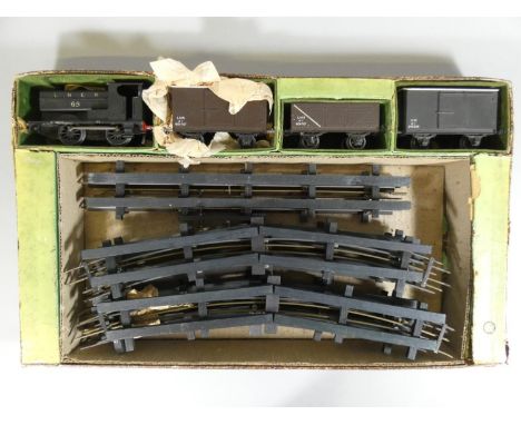 A boxed model railway train set by Leeds Model Co., to include LNER No. 65 loco, three wagons and a quantity of track. 