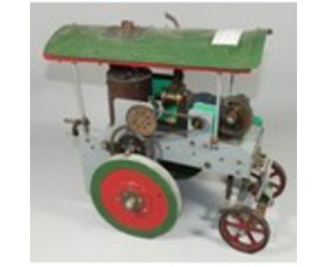 A live&nbsp; steam traction engine in green livery.