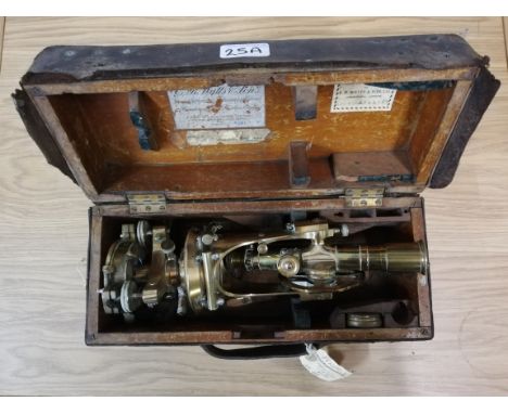 An oak and leather cased theodolite, by E. R. Watts &amp; Sons Ltd., with centre compass, No. 499.