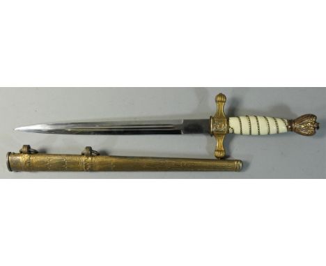 A Nazi naval officers dirk with ivorine grip, etched fullered blade by Eickhorn, Solingen, in gilt brass scabbard with lightn