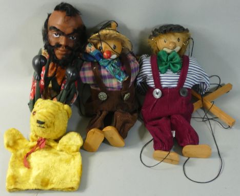 A group of four puppets to include Mr. T (Lawrence Tureaud) boxing hand puppet by Rojus, lion hand puppet and two wooden stri