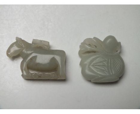 TWO JADE FIGURAL PENDANTS ,one in the form of a duck, the other in the form of a horse, both finely carved in shallow relief 