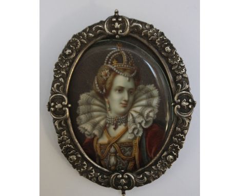 A LATE 18TH / EARLY 19TH CENTURY OVAL PORTRAIT MINIATURE OF A LADY IN A TUDOR DRESS, in white metal decorative framed, unsign