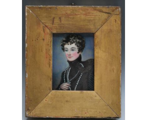 P. A 19th century portrait miniature of a young officer in dress uniform, in gold slip, signed with initial lower right, fram