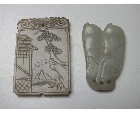A CHINESE CELADON JADE PENDANT, finely carved in shallow relief to one side with a landscape scene, character mark to the rev