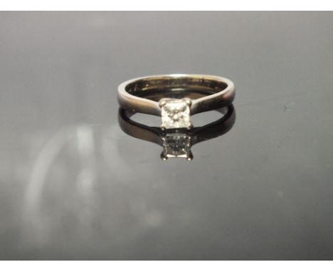 AN 18 CARAT WHITE GOLD PRINCESS CUT DIAMOND SOLITAIRE RING, the diamond being approx 0.40 carat, ring size L