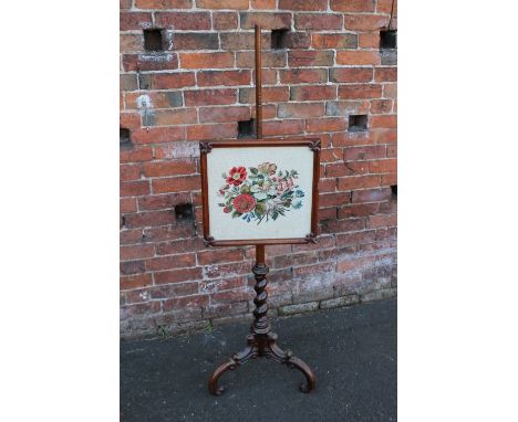 A 19TH CENTURY POLE SCREEN, the rectangular glazed screen with floral needlepoint detail, the lower section of the pole of ba