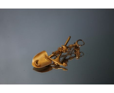AN UNUSUAL 18CT GOLD BROOCH IN THE FORM OF A PICK AXE AND A SHOVEL,  both having 'lumps' of gold upon them, approx weight 4.6