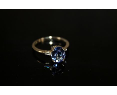 A HALLMARKED 14K GOLD AAA TANZANITE AND DIAMOND RING, the tanzanite being approx 2.6 carats, measures 10 mm x 8 mm, ring size