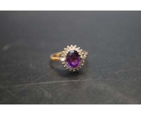 AN 18CT AMETHYST AND DIAMOND RING, ring size R