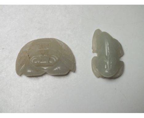 TWO JADE FIGURAL PENDANTS, one in the form of a crab, one in the form of a frog, largest W 4.6 cm (2)