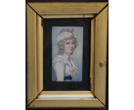 A LATE 19TH CENTURY PORTRAIT MINIATURE OF A LADY WEARING A WHITE DRESS WITH BLUE SASH AND PEARL NECKLACE, in a fruitwood fram
