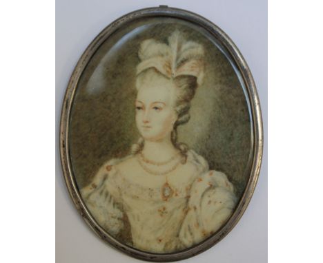 A 19TH CENTURY OVAL PORTRAIT MINIATURE OF AN ELEGANT LADY, in an oval white metal frame, unsigned, indistinctly inscribed ver