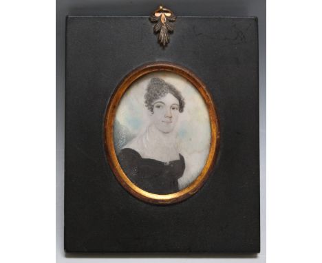 A LATE 19TH / EARLY 20TH CENTURY OVAL PORTRAIT MINIATURE OF A YOUNG LADY IN A BLACK DRESS, in a black frame with gilt metal f