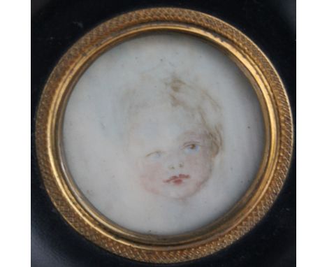 A LATE 19TH / EARLY 20TH CENTURY CIRCULAR PORTRAIT MINIATURE OF A YOUNG CHILD, in a circular black framed, unsigned, framed a