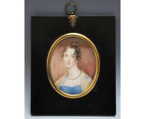 A 19TH CENTURY OVAL PORTRAIT MINIATURE OF A YOUNG LADY IN A BLUE DRESS WITH YELLOW SHAWL, and wearing a pearl necklace, in a 