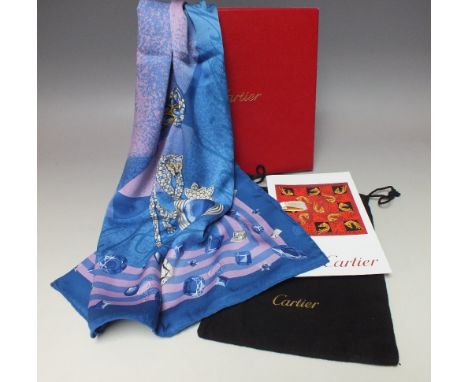 A CARTIER OF PARIS JEWELLED PATTERN SILK SCARF, depicting diamonds and sapphires, with jewelled leopards, planets etc., in or