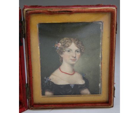A 19TH CENTURY PORTRAIT MINIATURE OF A YOUNG LADY WITH A RED NECKLACE, with gilt mount, set in a leather case, signed lower r