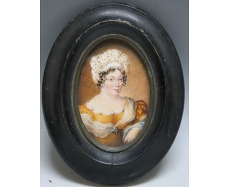 A LATE 19TH / EARLY 20TH CENTURY OVAL PORTRAIT MINIATURE OF A LADY IN A YELLOW DRESS, in oval black wooden frame, unsigned, f