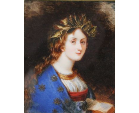 A LATE 19TH / EARLY 20TH CENTURY PORTRAIT MINIATURE OF A YOUNG WOMAN WITH BLUE SHAWL WITH STAR PATTERN, holding a book, in a 