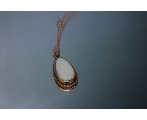 A HALLMARKED 9 CARAT GOLD TEAR DROP OPAL PENDANT, the opal being approx 2.8 mm x 1.3 mm