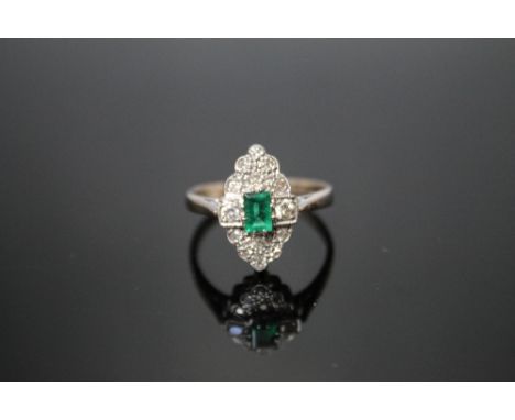 AN 18 CARAT WHITE GOLD EMERALD AND DIAMOND RING,  set with central emerald cut emerald, ring size T 1/2