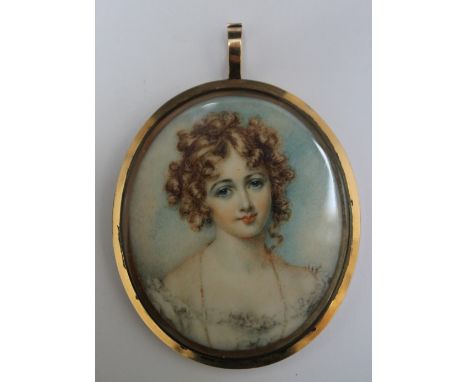 A LATE 19TH / EARLY 20TH CENTURY OVAL PORTRAIT MINIATURE OF A YOUNG WOMAN WITH RINGLETS, in gilt metal framed, unsigned, fram