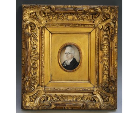 A LATE 19TH / EARLY 20TH CENTURY PORTRAIT MINIATURE OF A CLERIC WEARING GLASSES, in a gold swept frame, unsigned, framed and 