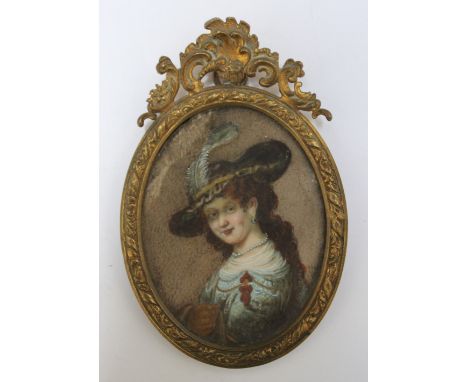 A NINETEENTH CENTURY OVAL PORTRAIT MINIATURE OF A LADY IN A PLUMED HAT, in an oval decorative gilt metal framed, unsigned, fr