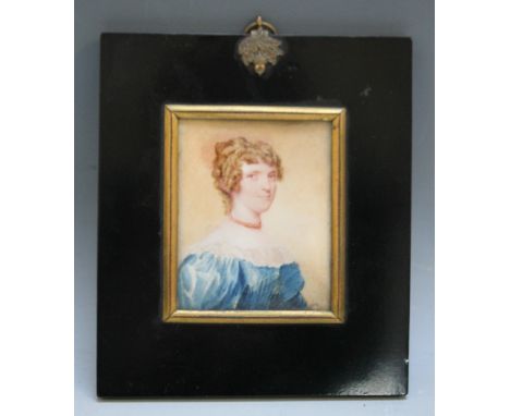 A LATE 19TH / EARLY 20TH CENTURY PORTRAIT MINIATURE OF A LADY IN A BLUE DRESS AND A RED NECKLACE, in a black frame with acorn