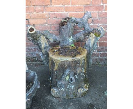 A 19TH CENTURY TREACLE GLAZE GARDEN SEAT, modelled as a tree trunk, H 82 cm, W 82 cm A/F