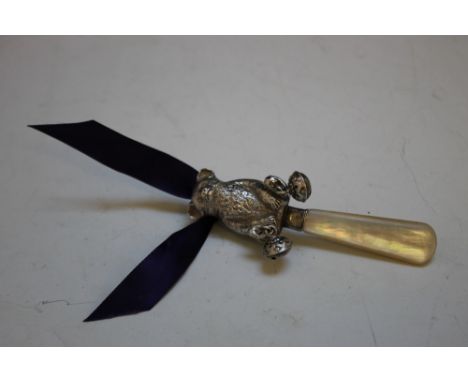 A MOTHER OF PEARL HANDLED BABY'S RATTLE IN THE FORM OF A BEAR, with a bell hanging from each foot, L 10.5 cm