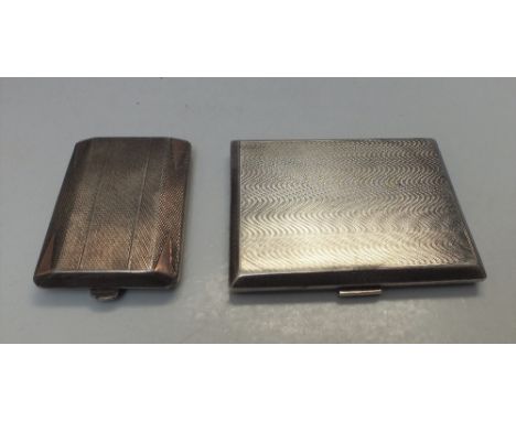 A HALLMARKED SILVER MATCHBOOK HOLDER - CHESTER 1957, W 6.5 cm, D 4.7 cm, H 1 cm, with engine turned decoration and inset yell