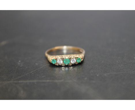 A HALLMARKED 9 CARAT GOLD EMERALD AND DIAMOND RING, ring size S