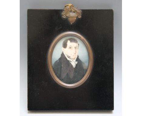 A 19TH CENTURY OVAL PORTRAIT MINIATURE OF A GENTLEMAN IN A BLACK COAT AND WHITE CRAVAT, in black frame with acorn finial, uns