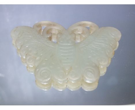 A SMALLER CHINESE CELADON JADE CARVED INSECT / MOTH PLAQUE, finely carved in shallow relief with typical decoration, W 8.5 cm