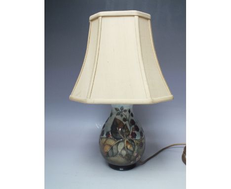 A MOORCROFT BLACKBERRY PATTERN TABLE LAMP, green and blue ground with typical tubelined decoration, H 20 cm (not inc. fitment