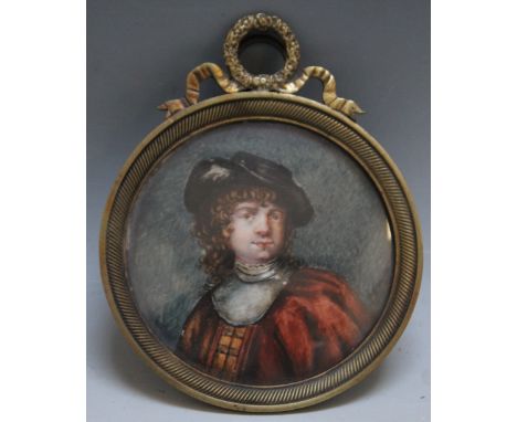 A 19TH CENTURY CIRCULAR PORTRAIT MINIATURE OF A GENTLEMAN IN CAROLEAN DRESS, in a circular decorative gilt metal frame, unsig