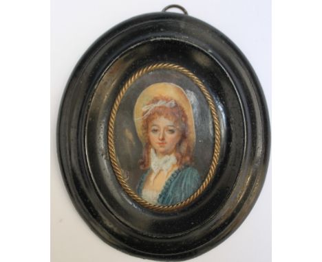 A 19TH CENTURY OVAL PORTRAIT MINIATURE OF A YOUNG LADY IN A BLUE DRESS AND WEARING A LARGE HAT, in an oval black framed, unsi