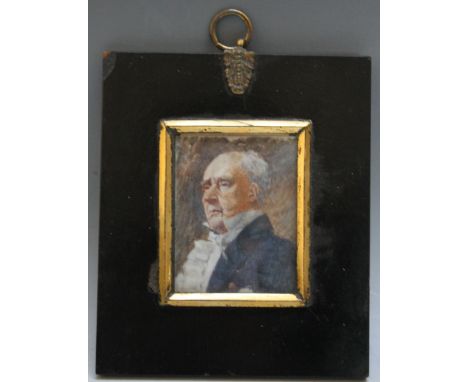A LATE 19TH / EARLY 20TH CENTURY PORTRAIT MINIATURE OF A GENTLEMAN IN A BLUE COAT, in a black frame with gilt metal finial, u